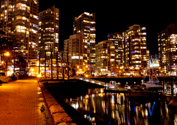 Illuminated at night, Yaletown is connected by Vancouver's seawall