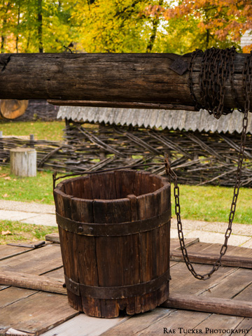 Wooden bucket sits atop a well in Bucharest, Romania