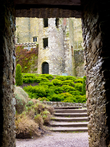 A stone doorway leads to the Blarney Castle in Ireland.