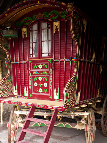 An ornately painted wooden wagon in ireland.