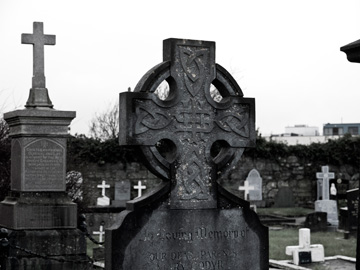 Celtic Cross headstones in a graveyard in Galway, Ireland.