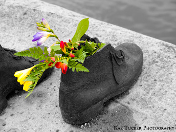 A stone shoe filled with flowers, representing the victims of the Holocaust in Budapest, Hungary