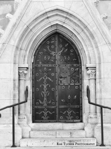A black and white image of an ornate door on Matthias Church in Budapest, Hungary