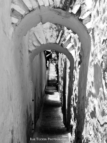 A black and white image of a narrow walkway in Szentendre, Hungary