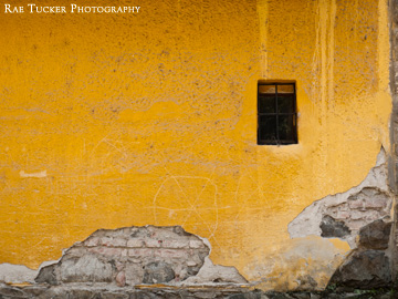 A worn yellow wall in Szentendre, Hungary