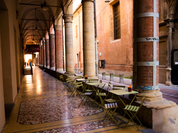 A small patio under a portico in Bologna, Italy