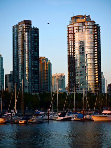 Condo buildings and sailboats along Vancouver's False Creek