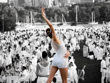 A dancer performs before a large crowd in Vancouver, Canada