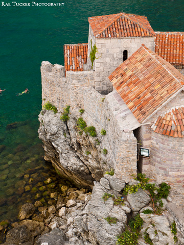 Red-tiled roofs top the stone buildings in Budva's old town in Montenegro.