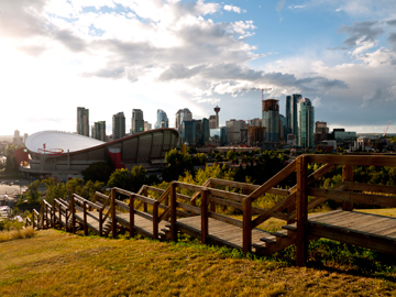 A view of the Saddledome and downtown Calgary, Alberta on a cloudy day.