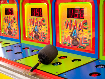 A Whac-A-Mole game at a carnival