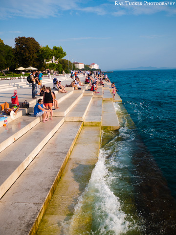 Waves crash against the Sea Organ in Zadar, Croatia