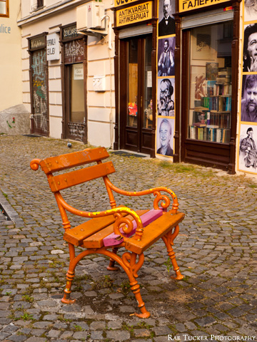 An orange bench in front of a book store in Ljubljana, Slovenia