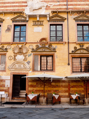 A small restaurant patio in Piazza dei Signori in Verona, Italy
