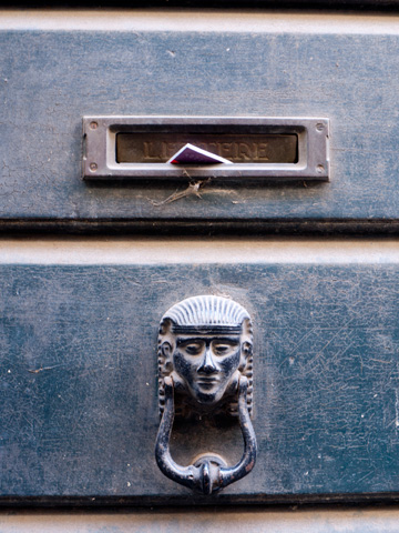 An egyptian-styled door knocker in Italy