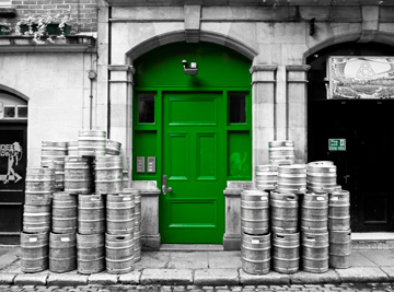 A green door and beer kegs in Dublin, Ireland