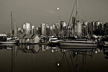 A harbour sits at the forefront of the Vancouver skyline in British Columbia, Canada