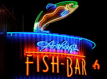 A neon sign advertises Anthony's Fish Bar in Seattle, Washington