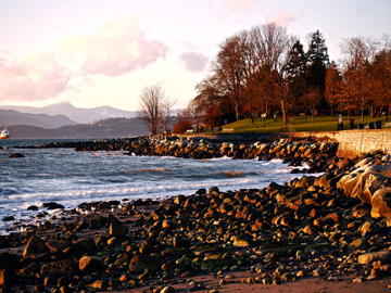 Rocks are visible only during low tide at English Bay in Vancouver, Canada