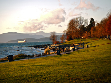English Bay in Vancouver, British Columbia is lined by the seawall and surrounding park