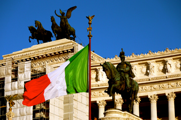 The Italian Flag flies in front of the Monument di Vittorio II