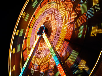 A ferris wheel in motion at night