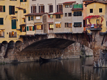 The Ponte Vecchio stands over the Arno River in Florence, Italy
