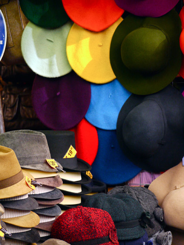 Hats displayed at a market stall in Florence, Italy