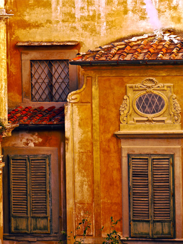 Decorative windows on the back of the Pitti Palazzo in Florence, Italy