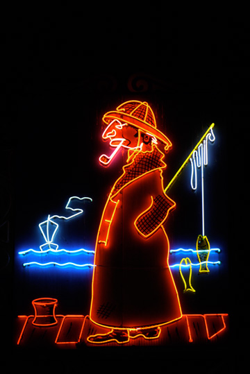A neon sign sporting a fisherman at Fisherman's Wharf in San Francisco, California