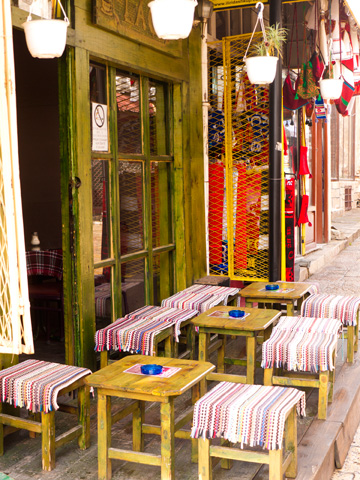 Stools and tables at a small cafe in Skopje, Macedonia