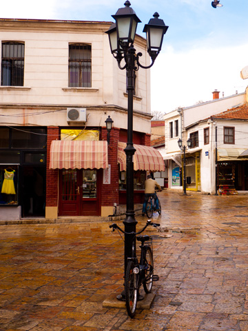 A bicycle rests against a lamp post in the old stone streets of Skopje, Macedonia