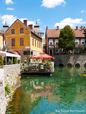 The pond in Tapolca, Hungary sparkles under the summer sun