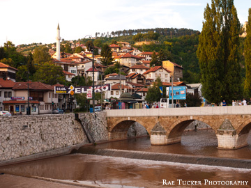 The riverbank in the glow of the setting sun in Sarajevo, Bosnia