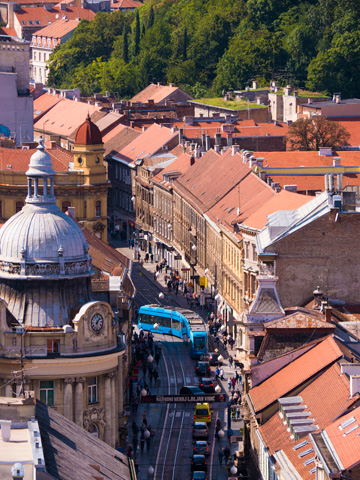 Trams and traffic fill a Zagreb street