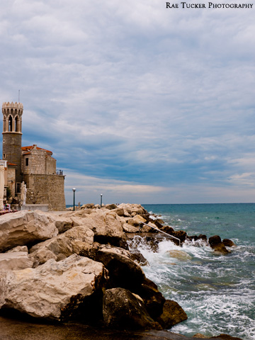 Waves crash on the rocks in Piran, Slovenia