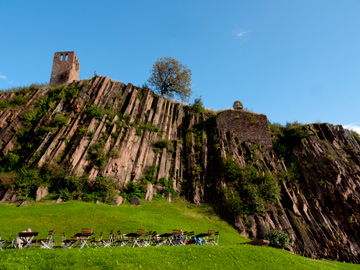 A cliff side overlooks a garden patio at the Mountain Messner Museum in Bolzano