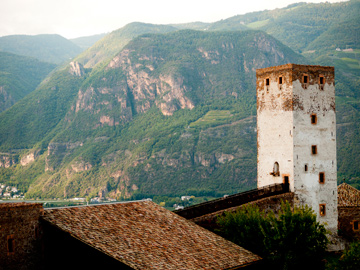 Architectural details against a mountainous backdrop in Bolzano, Italy