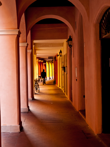 A portico in Modena shines with reds, yellows and oranges