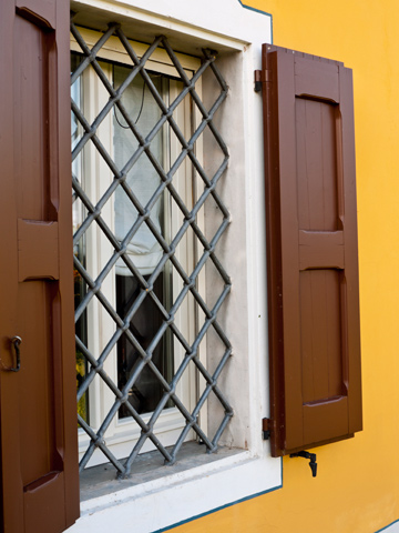 Wooden shutters on a window at an acetaia in Modena, Italy