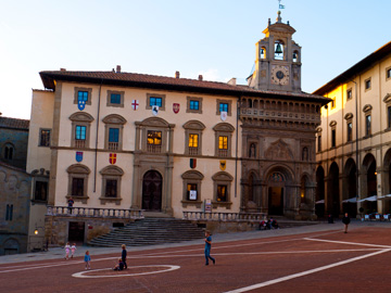 Children play in Piazza Grande in Arezzo, Italy