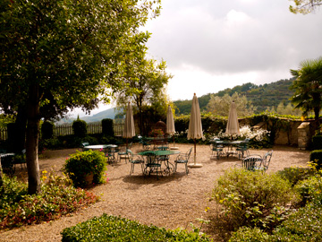 Overlooking the Tuscan hills, a terrace glows undering the autumn, afternoon sun.
