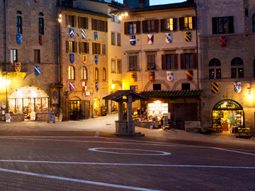 In Piazza Grande in Arezzo, Italy, the night brings upon glowing lights.