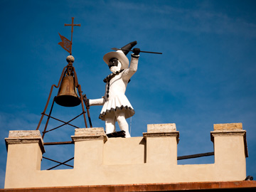 A statue of the Italian character Pulcinella in Montepulciano, Italy.