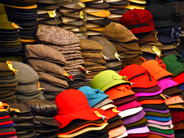 Hats displayed at a market stall in Florence, Italy