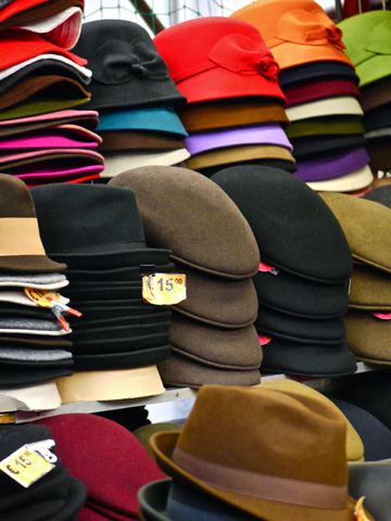 Hats displayed at a market stall in Florence, Italy